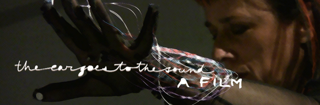 face and hand with lettering